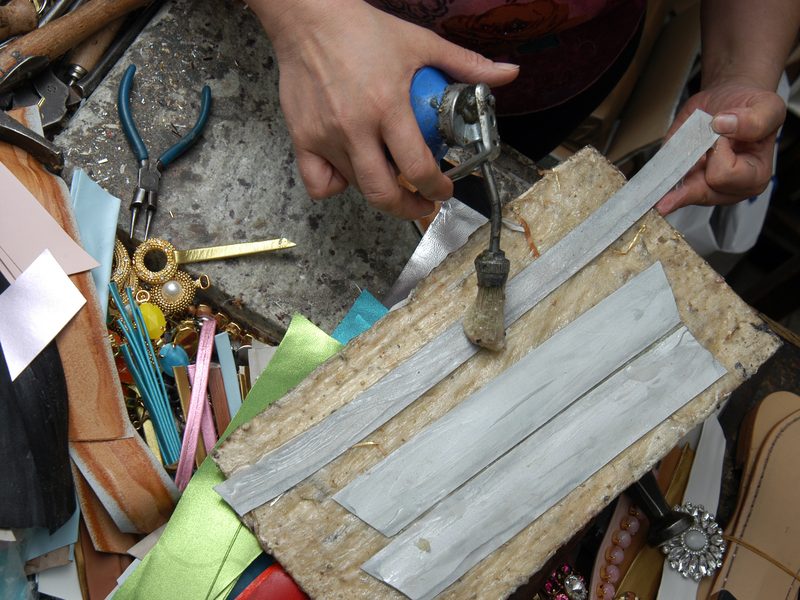 The workbench, with tools and straps being prepared